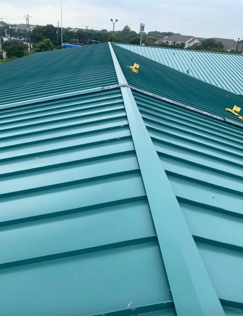 Green commercial metal roof ridge and valley for Metal Roof Repair in Sunbury